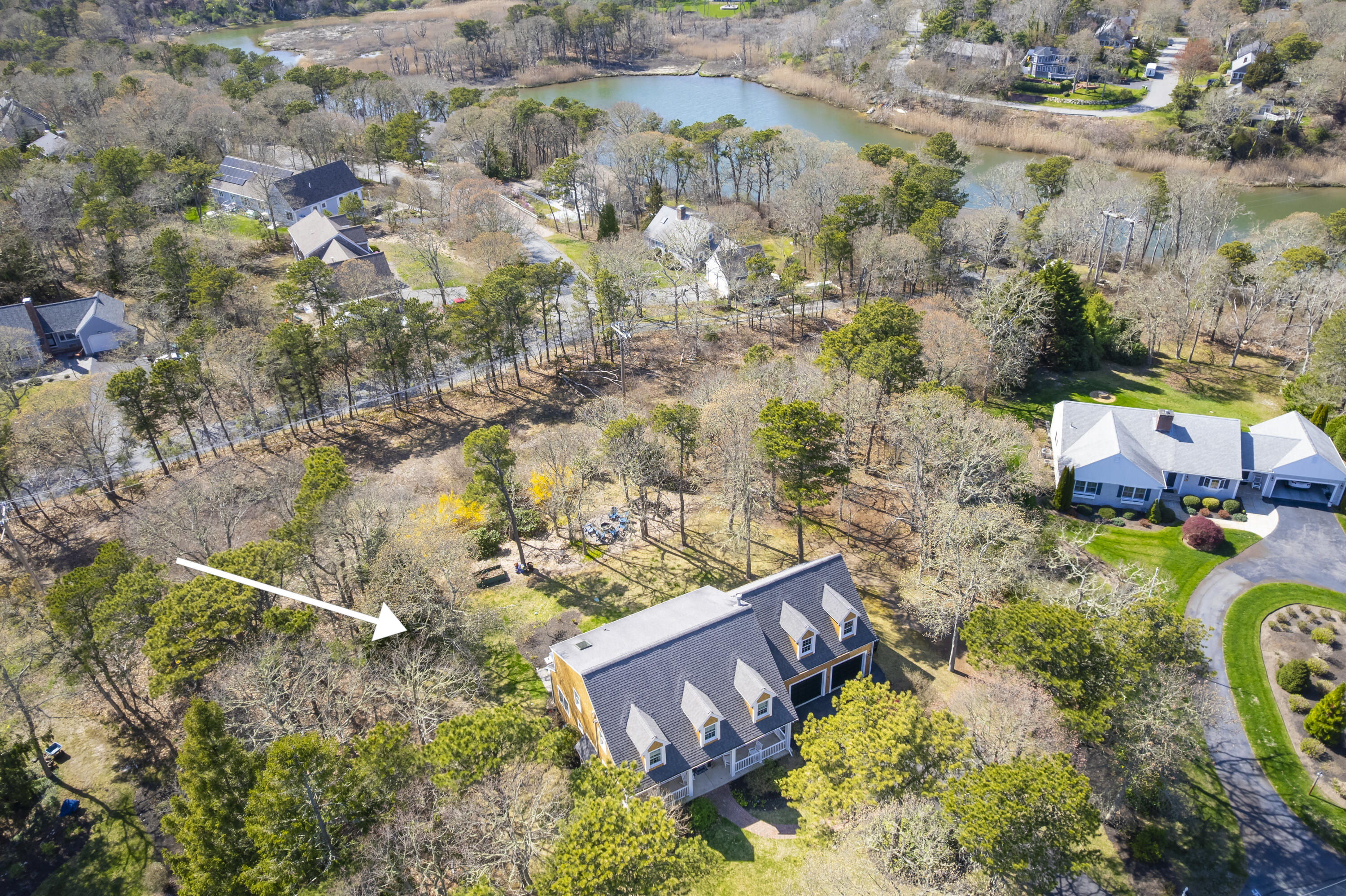 331 Riverview Drive Chatham, MA 02633 - Photo 6 of 50 an aerial view of a house with a yard swimming pool and outdoor seating