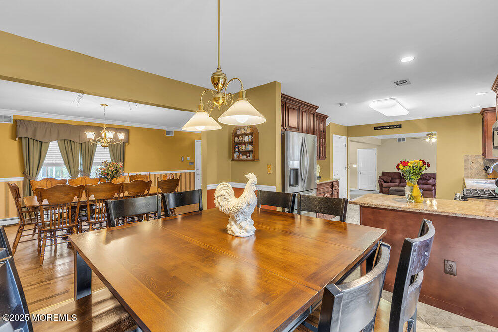 627 Reed Road Jackson, NJ 08527 - Photo 12 of 44 a dining room with lots of tables and chairs