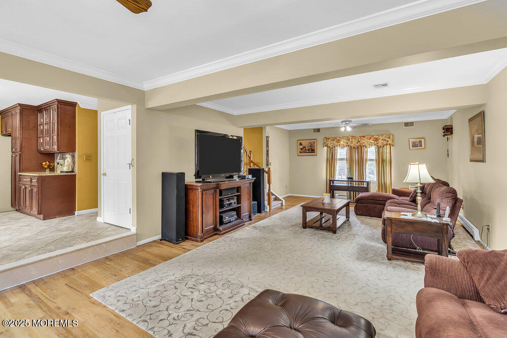 627 Reed Road Jackson, NJ 08527 - Photo 14 of 44 a living room with furniture and a flat screen tv