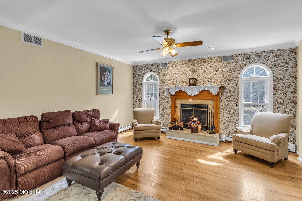 627 Reed Road Jackson, NJ 08527 - Photo 15 of 44 a living room with furniture and a fireplace