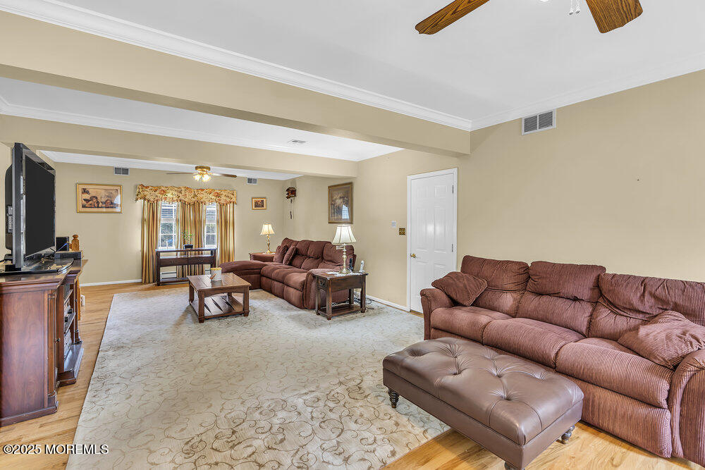627 Reed Road Jackson, NJ 08527 - Photo 16 of 44 a living room with furniture and a flat screen tv