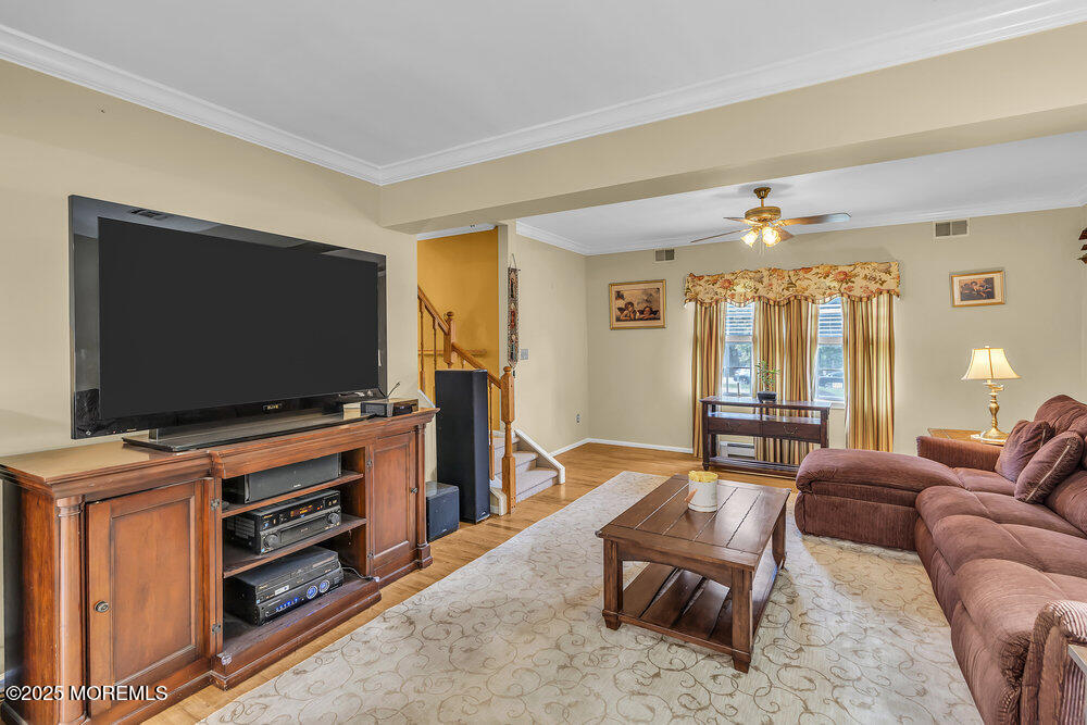 627 Reed Road Jackson, NJ 08527 - Photo 17 of 44 a living room with furniture and a flat screen tv