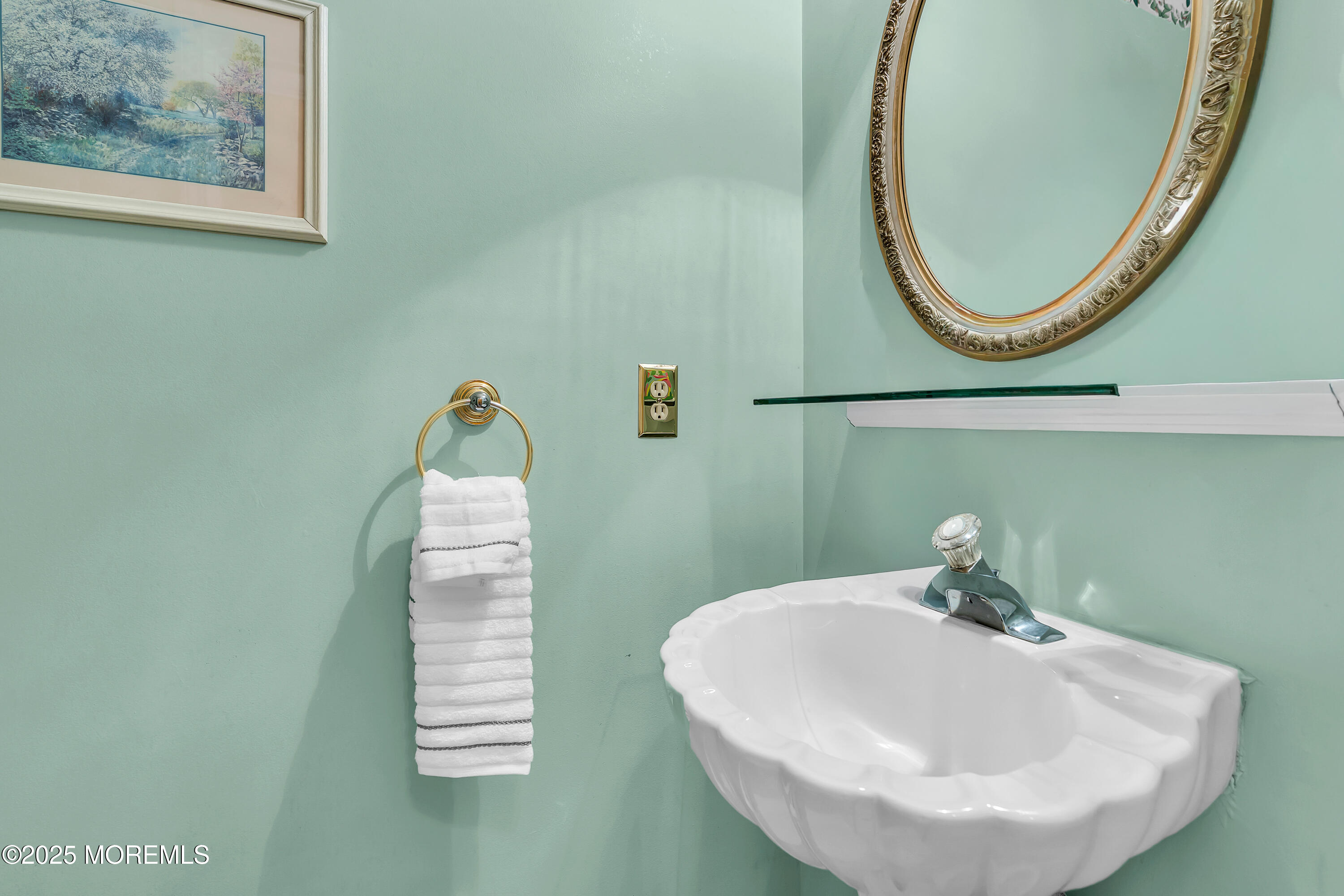 627 Reed Road Jackson, NJ 08527 - Photo 18 of 44 a close up of a sink and a mirror