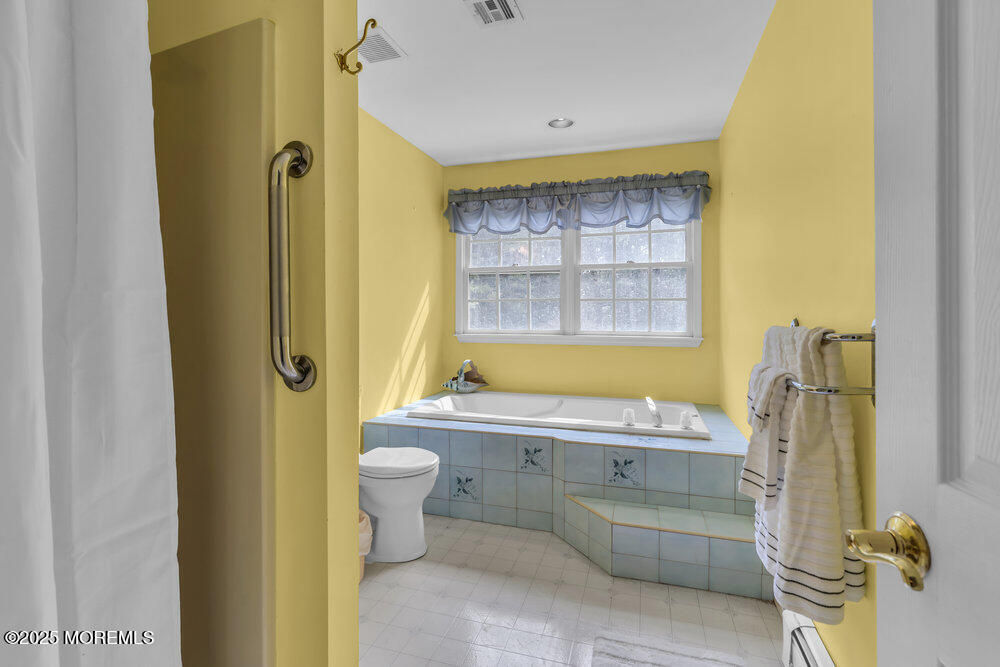 627 Reed Road Jackson, NJ 08527 - Photo 20 of 44 a bathroom with a granite countertop sink toilet and shower