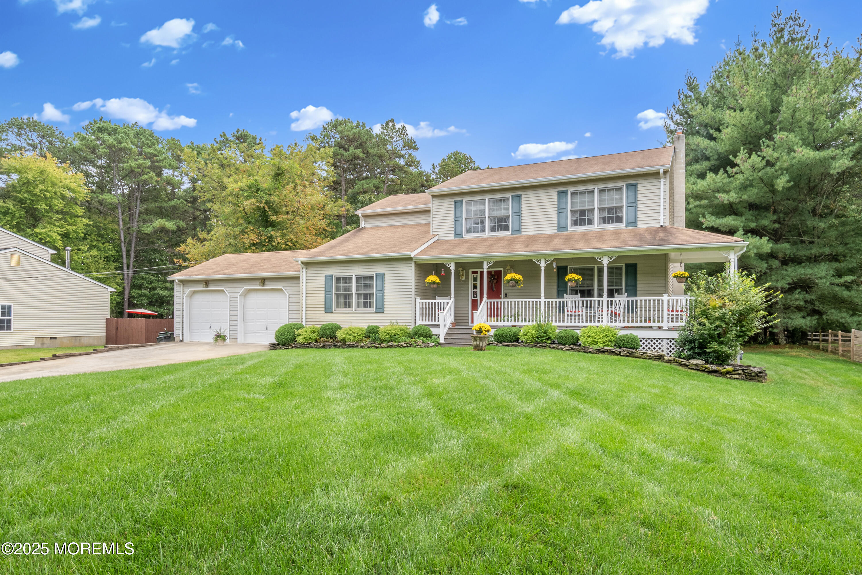 627 Reed Road Jackson, NJ 08527 - Photo 2 of 44 a front view of a house with a yard