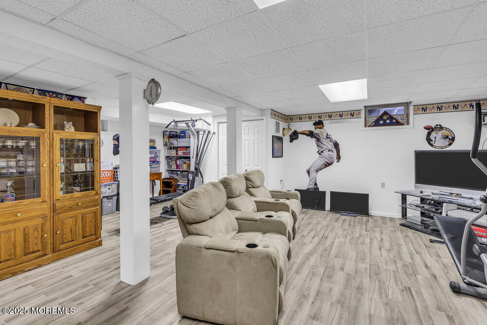 627 Reed Road Jackson, NJ 08527 - Photo 27 of 44 a living room with furniture and a flat screen tv