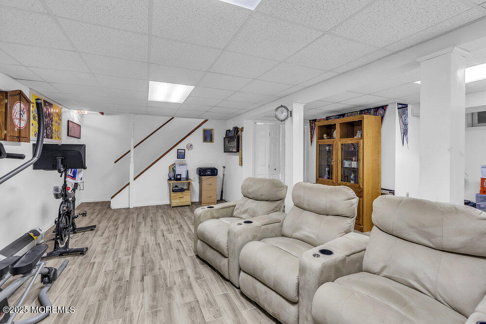 627 Reed Road Jackson, NJ 08527 - Photo 28 of 44 a living room with furniture and wooden floor
