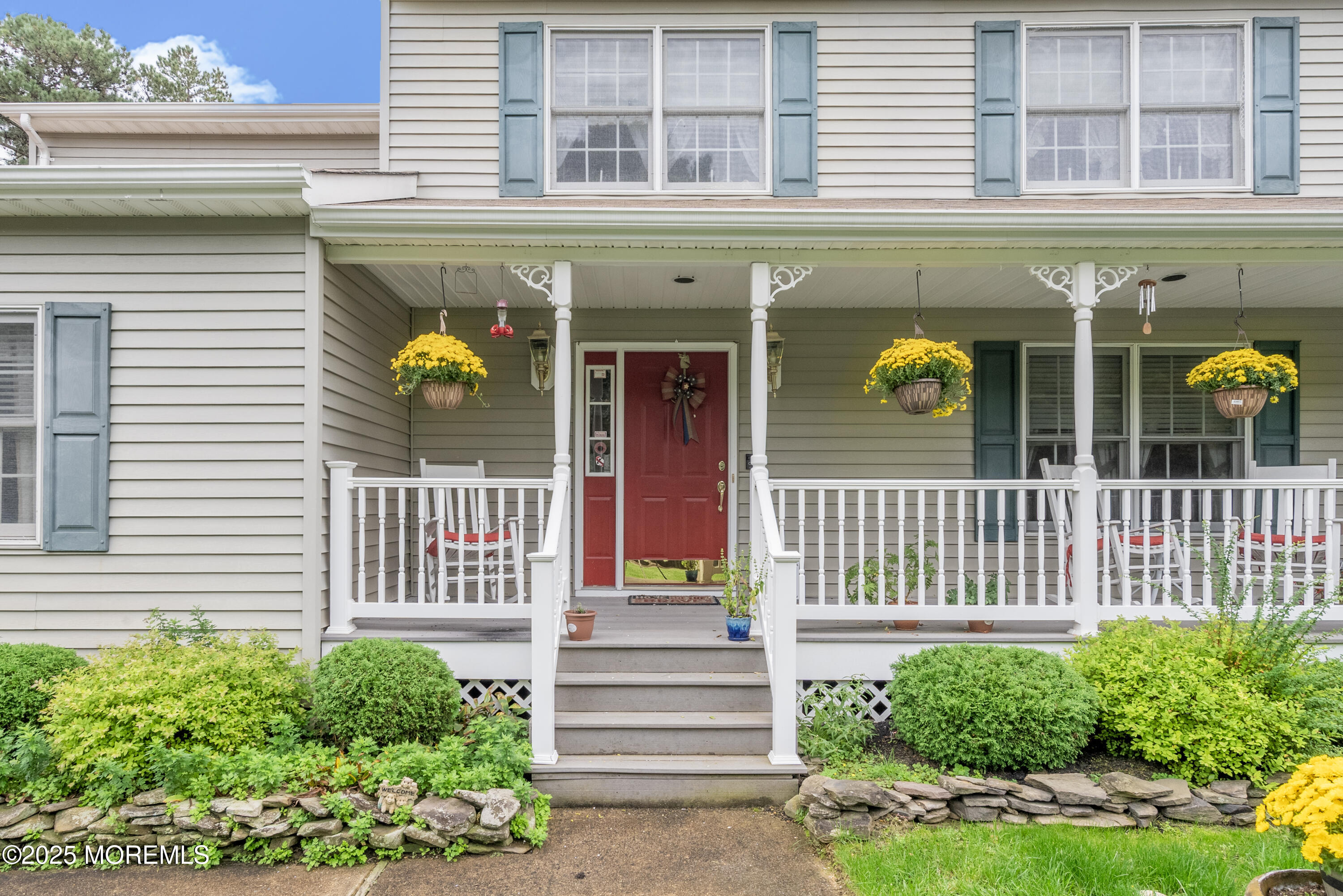 627 Reed Road Jackson, NJ 08527 - Photo 3 of 44 a front view of a house with a porch