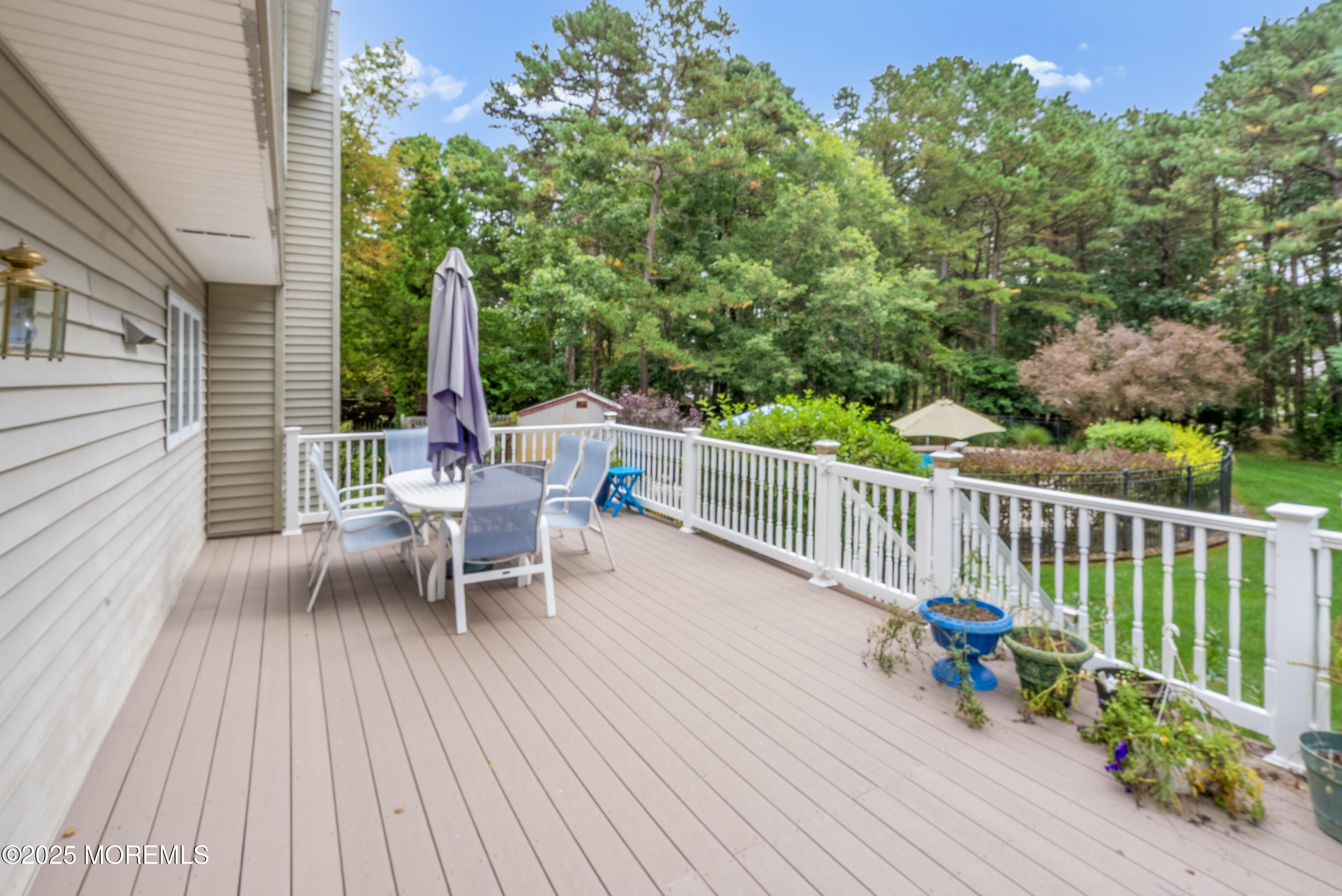 627 Reed Road Jackson, NJ 08527 - Photo 31 of 44 a view of a chairs on a deck