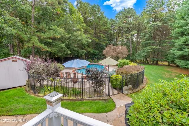 a view of a swimming pool with a patio
