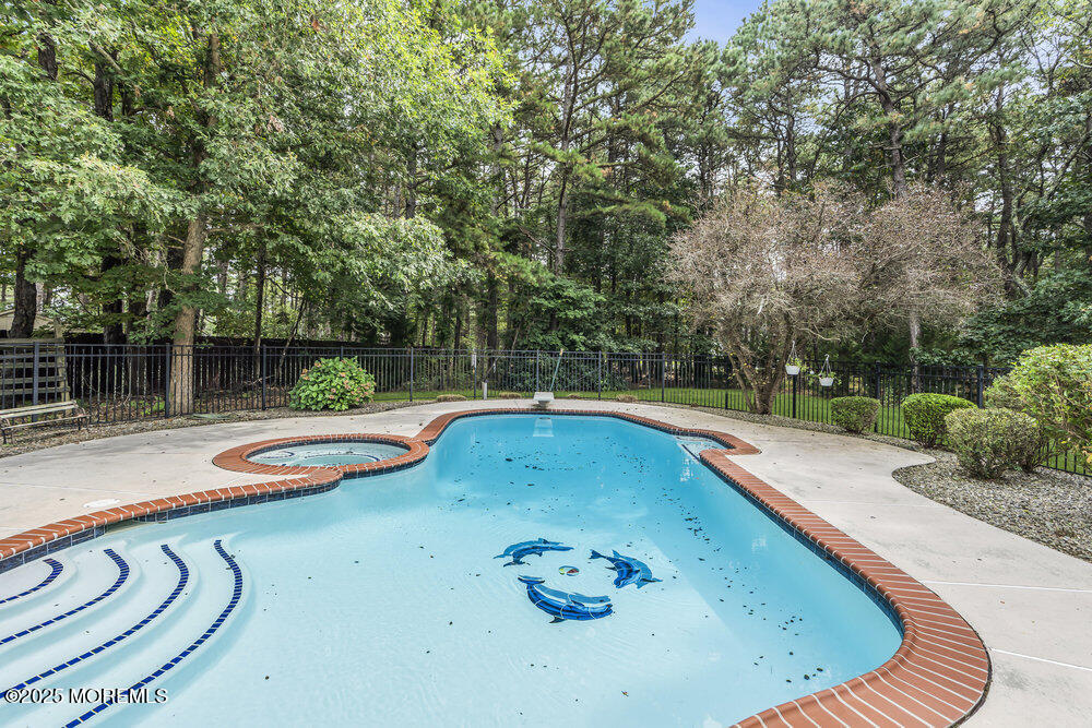 627 Reed Road Jackson, NJ 08527 - Photo 33 of 44 a view of a swimming pool with a patio