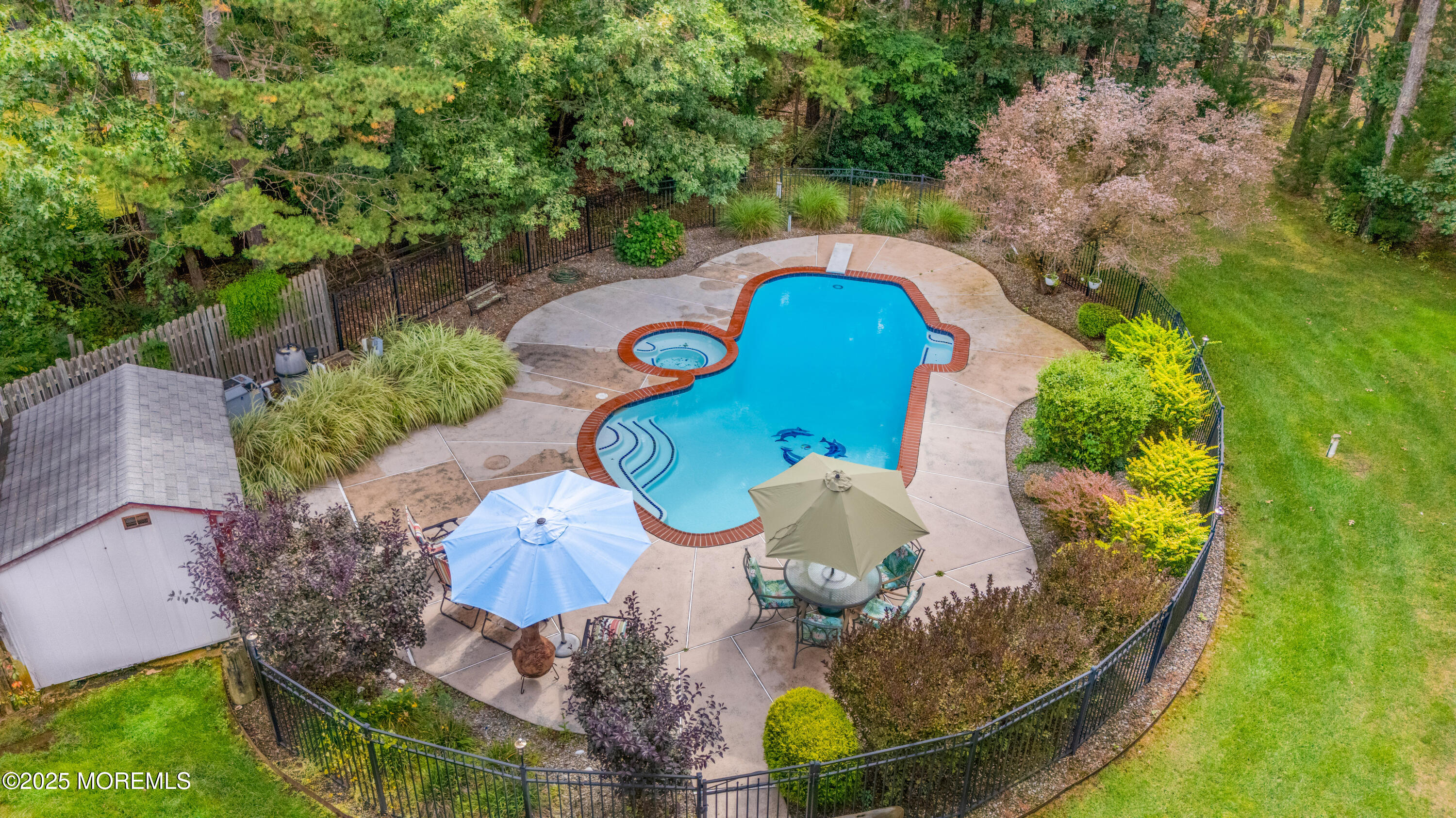 627 Reed Road Jackson, NJ 08527 - Photo 40 of 44 an aerial view of a house with a yard and swimming pool