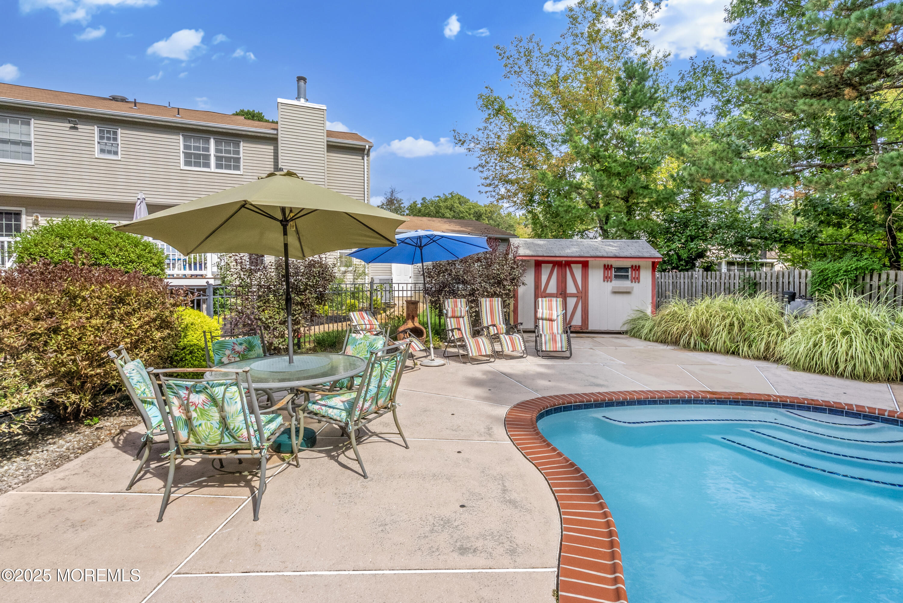 627 Reed Road Jackson, NJ 08527 - Photo 42 of 44 a view of a house with swimming pool and sitting area