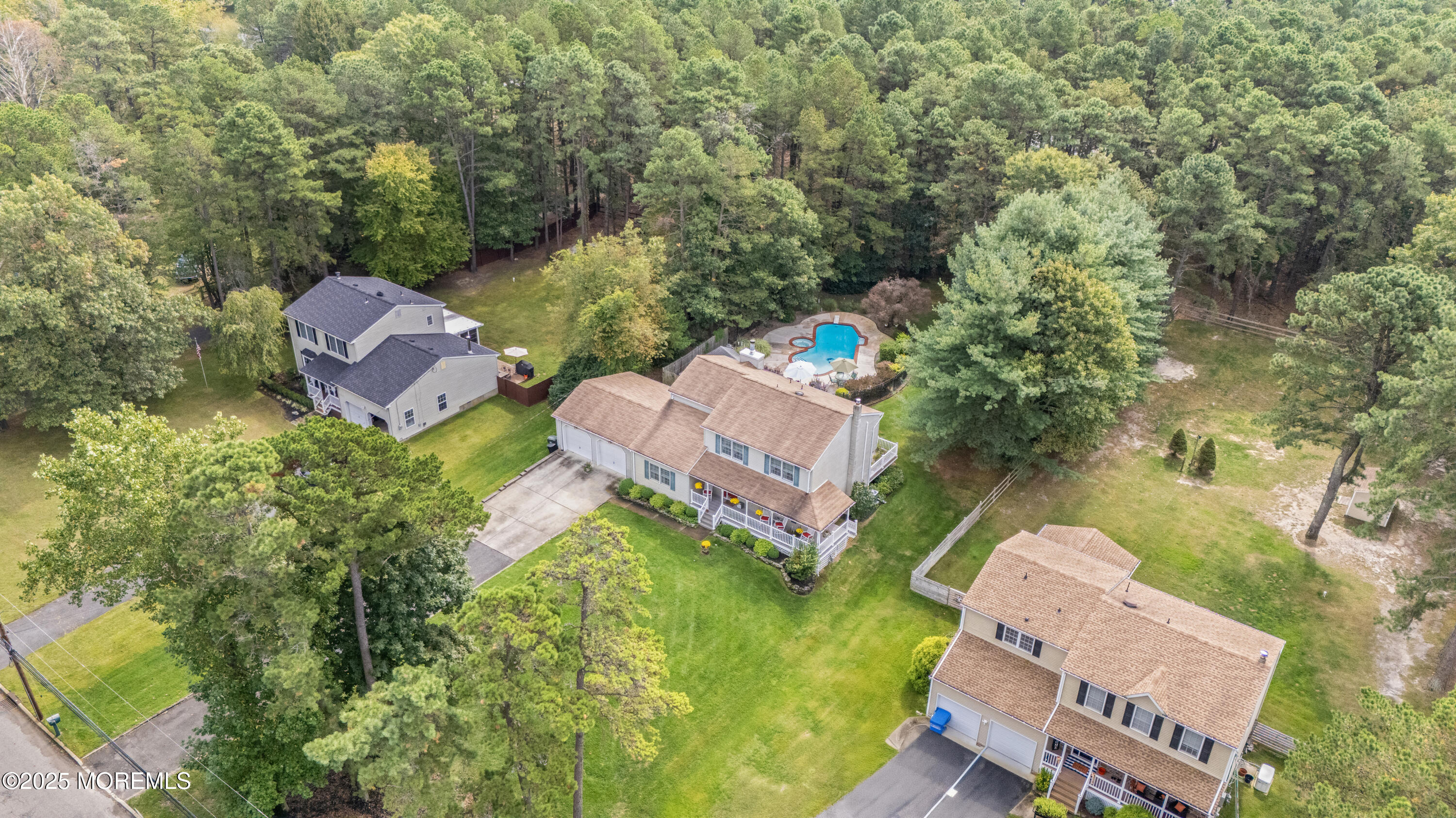 627 Reed Road Jackson, NJ 08527 - Photo 43 of 44 an aerial view of a house with a garden and swimming pool