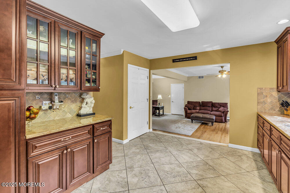 627 Reed Road Jackson, NJ 08527 - Photo 10 of 44 a spacious bathroom with a granite countertop sink and a mirror