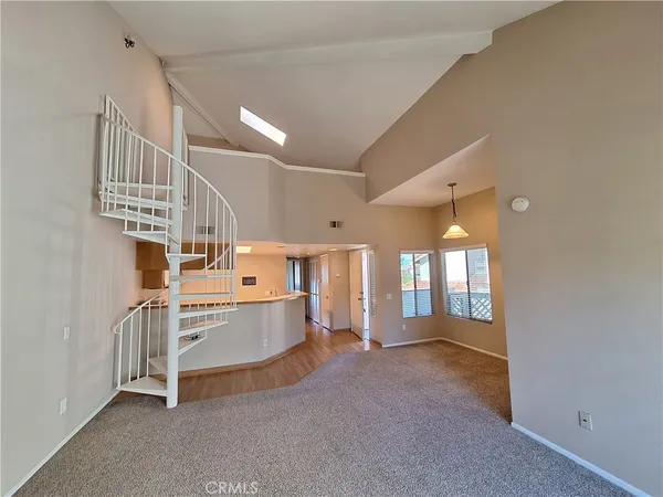 a view of a kitchen with a sink and cabinets