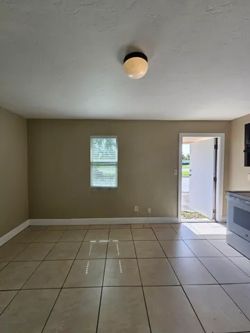 a view of an empty room and window