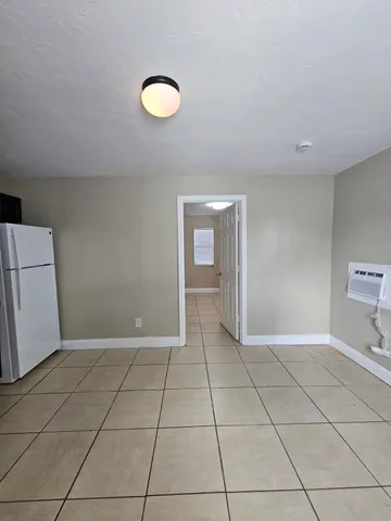 a kitchen with appliances cabinets and a counter top space