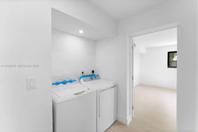 a utility room with dryer and washer