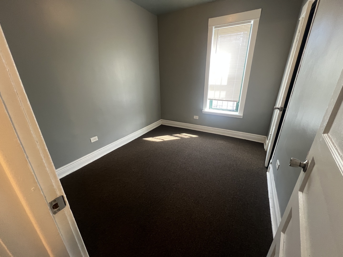 734 East 95th Street, Unit 1E Chicago, IL 60619 - Photo 4 of 7 a view of empty room with window
