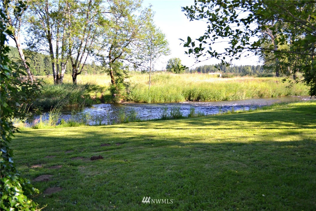 1462 North Fork Road Chehalis, WA 98532 - Photo 17 of 23 a view of a swimming pool with an outdoor space and seating area