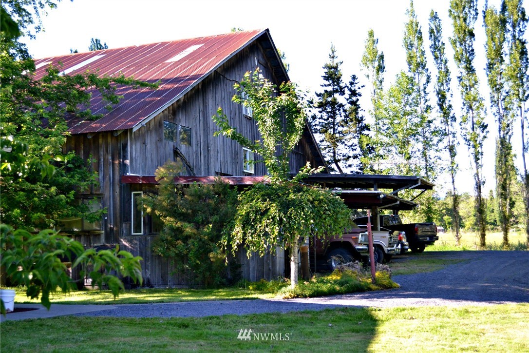 1462 North Fork Road Chehalis, WA 98532 - Photo 18 of 23 a view of a house with swimming tub and a yard