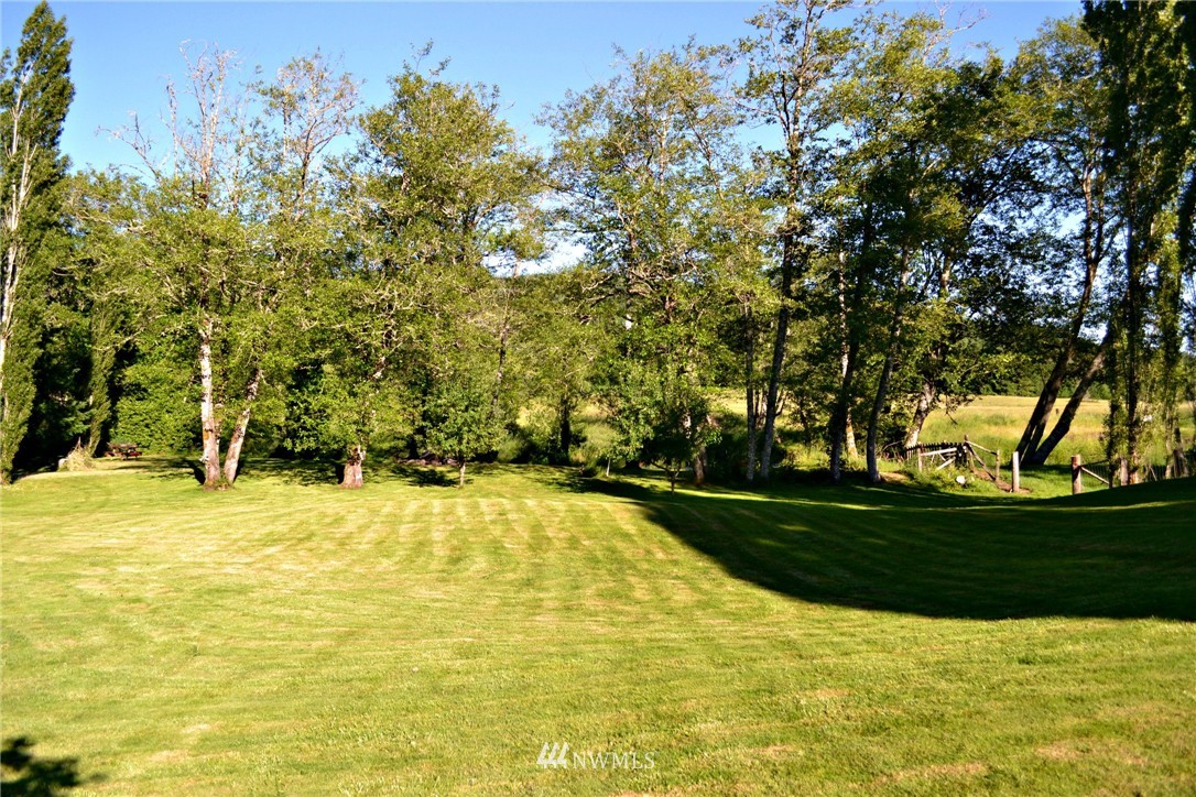 1462 North Fork Road Chehalis, WA 98532 - Photo 5 of 23 a view of a swimming pool with an outdoor space and seating area