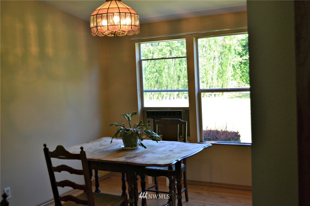 1462 North Fork Road Chehalis, WA 98532 - Photo 8 of 23 a view of a dining room with furniture and window
