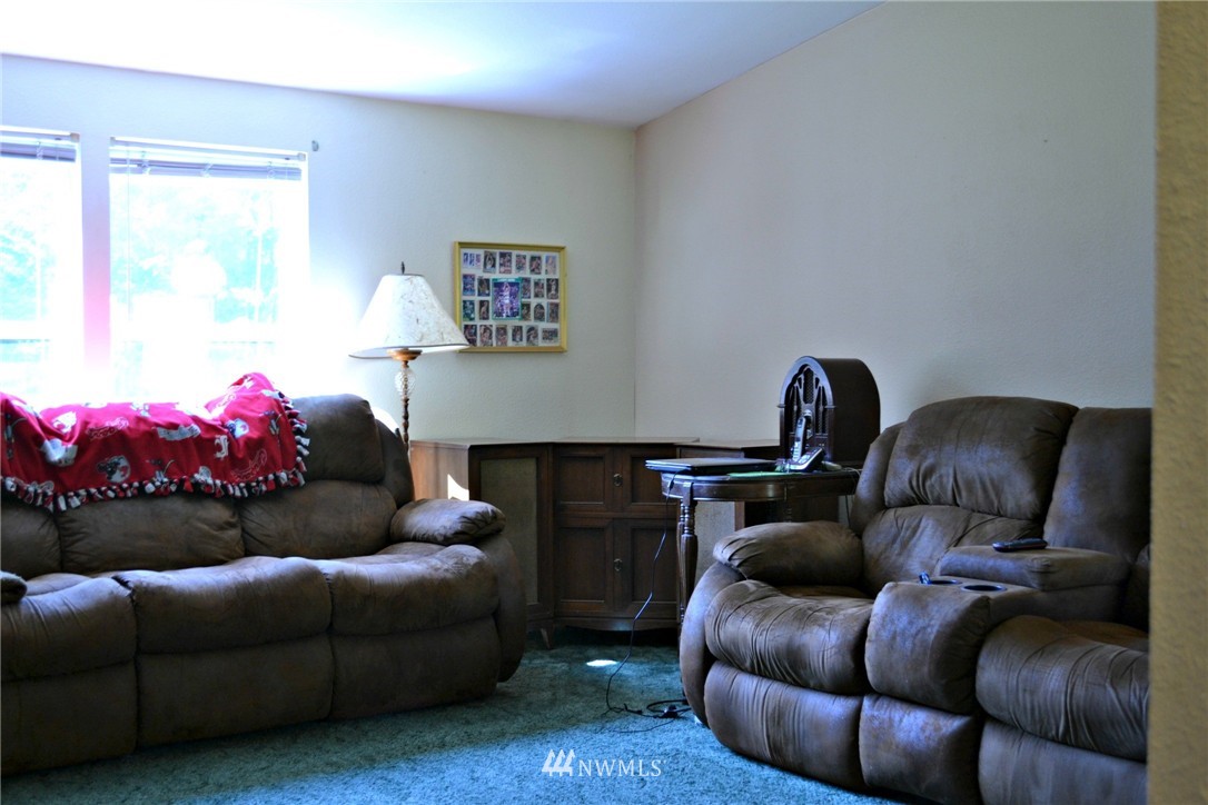 1462 North Fork Road Chehalis, WA 98532 - Photo 9 of 23 a living room with furniture and a fireplace