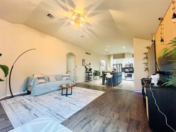 a living room with fireplace furniture and a flat screen tv