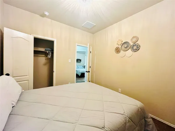 a large white bed in a white room