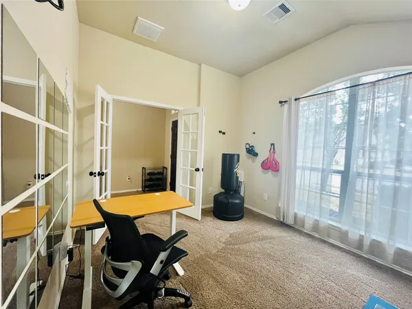 a bedroom with furniture and a window