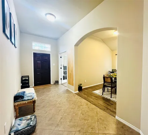 a view of a livingroom with furniture and a window