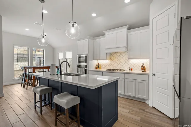 a kitchen with counter space sink and appliances