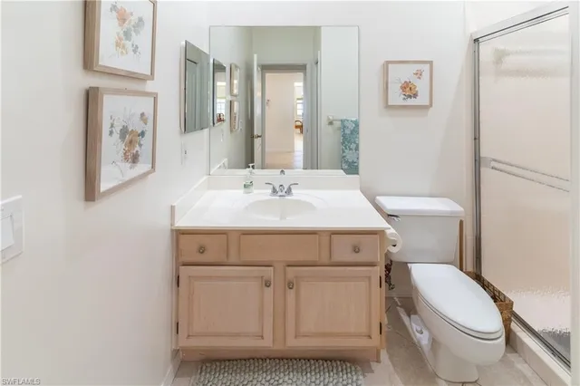 a bathroom with a sink toilet and mirror