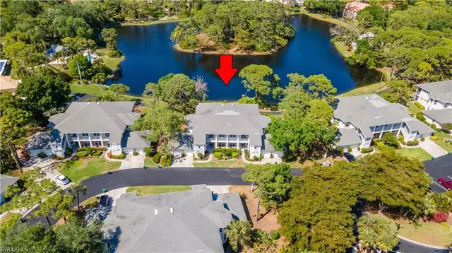 an aerial view of a house with a yard and garden