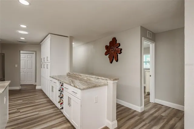 a bathroom with a granite countertop sink