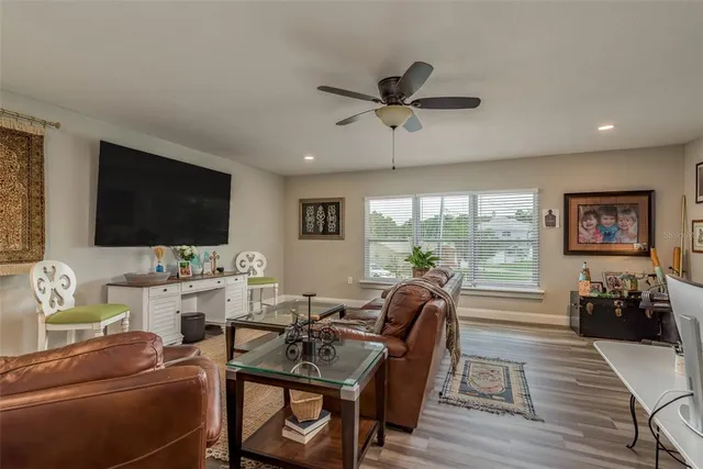 a living room with fireplace furniture and a flat screen tv