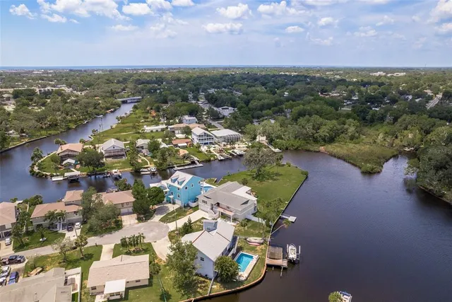 an aerial view of residential houses with outdoor space