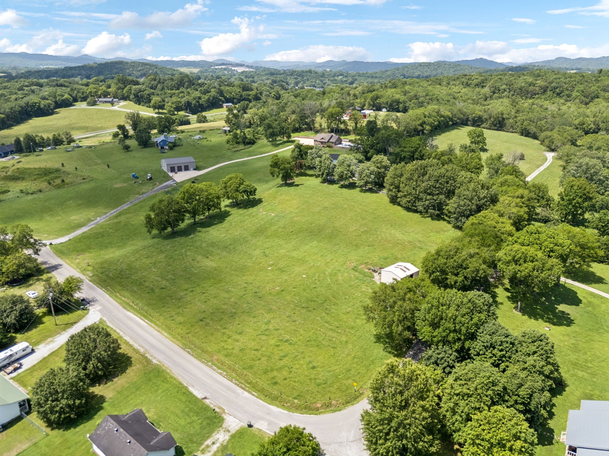 0 Maple Street Gordonsville, TN 38563 - Photo 4 of 11 a view of a lake with a city