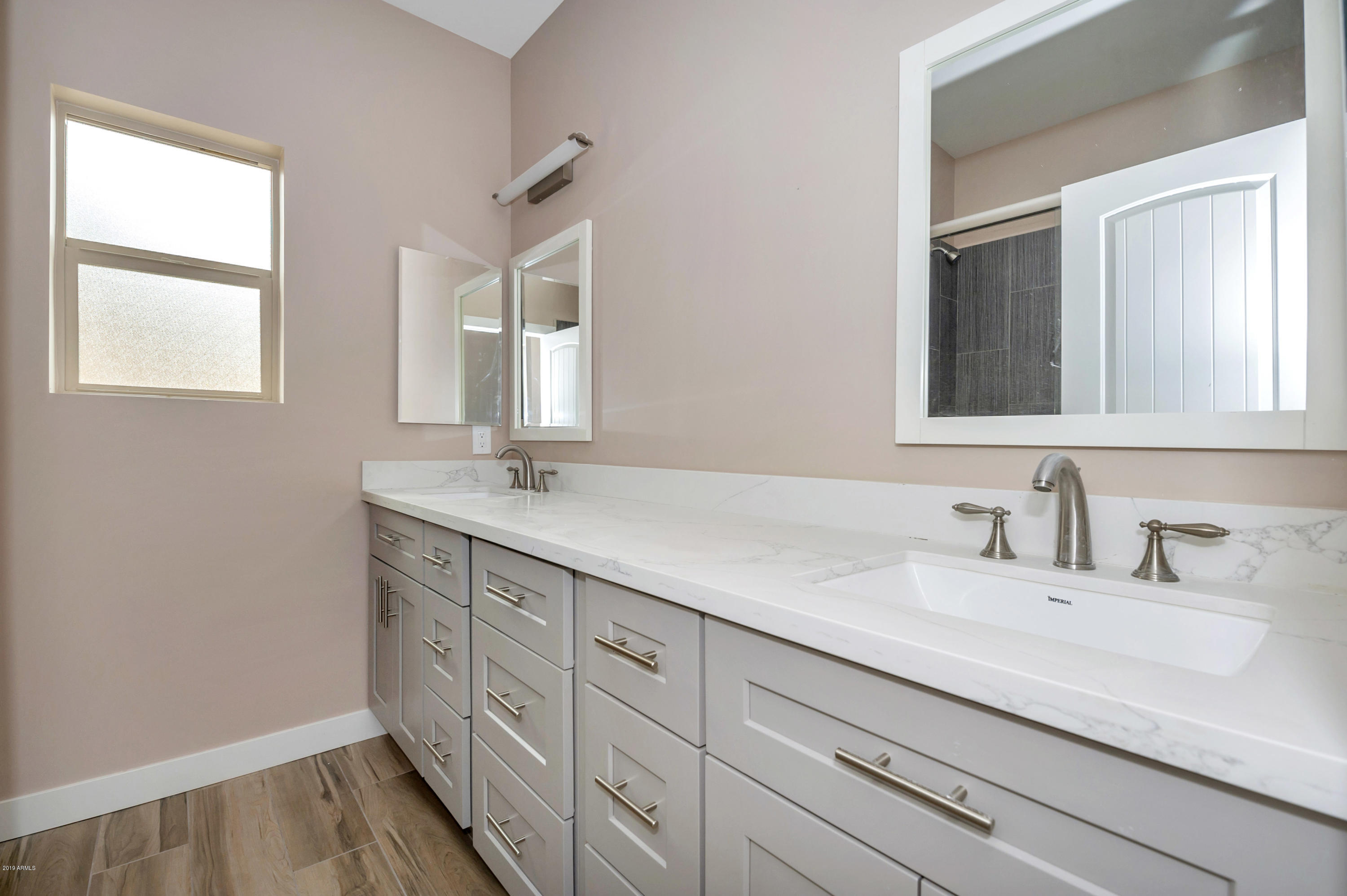 2635 East Contention Mine Road Phoenix, AZ 85032 - Photo 11 of 11 a bathroom with a sink and a mirror