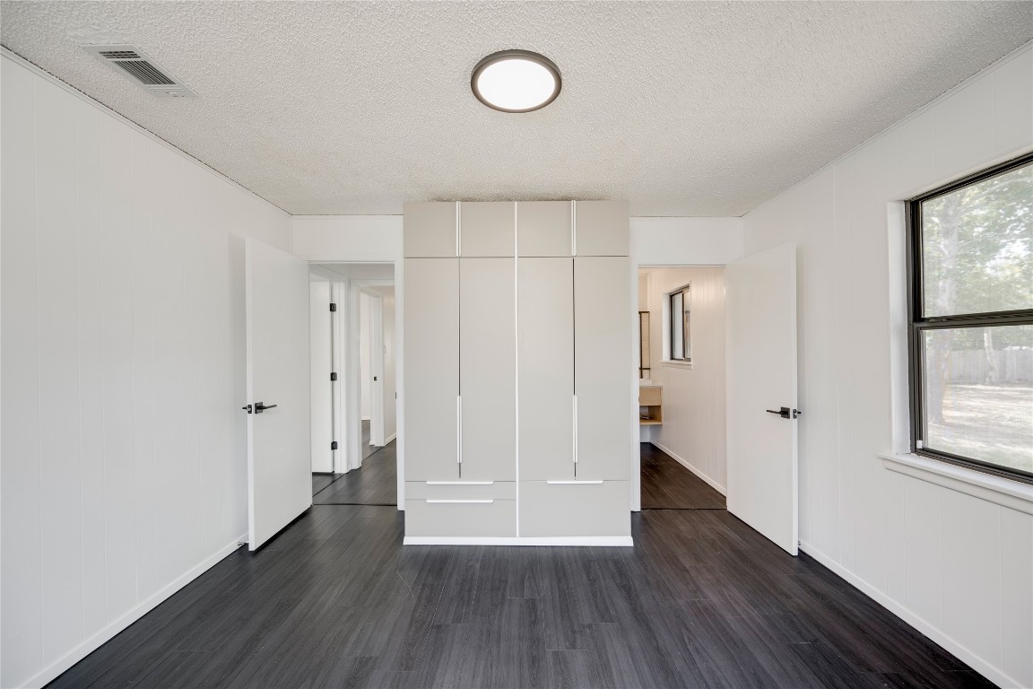 4948 Crossover Road San Marcos, TX 78666 - Photo 12 of 16 a view of a room with wooden floor and window