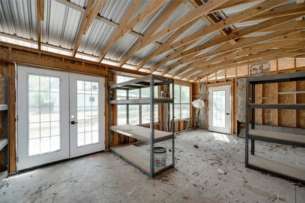 a view of an empty room with windows