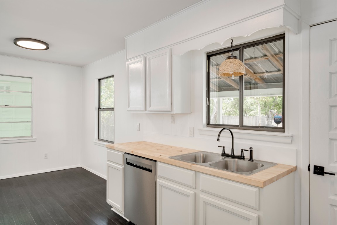 4948 Crossover Road San Marcos, TX 78666 - Photo 7 of 16 a kitchen with a sink cabinets and a window