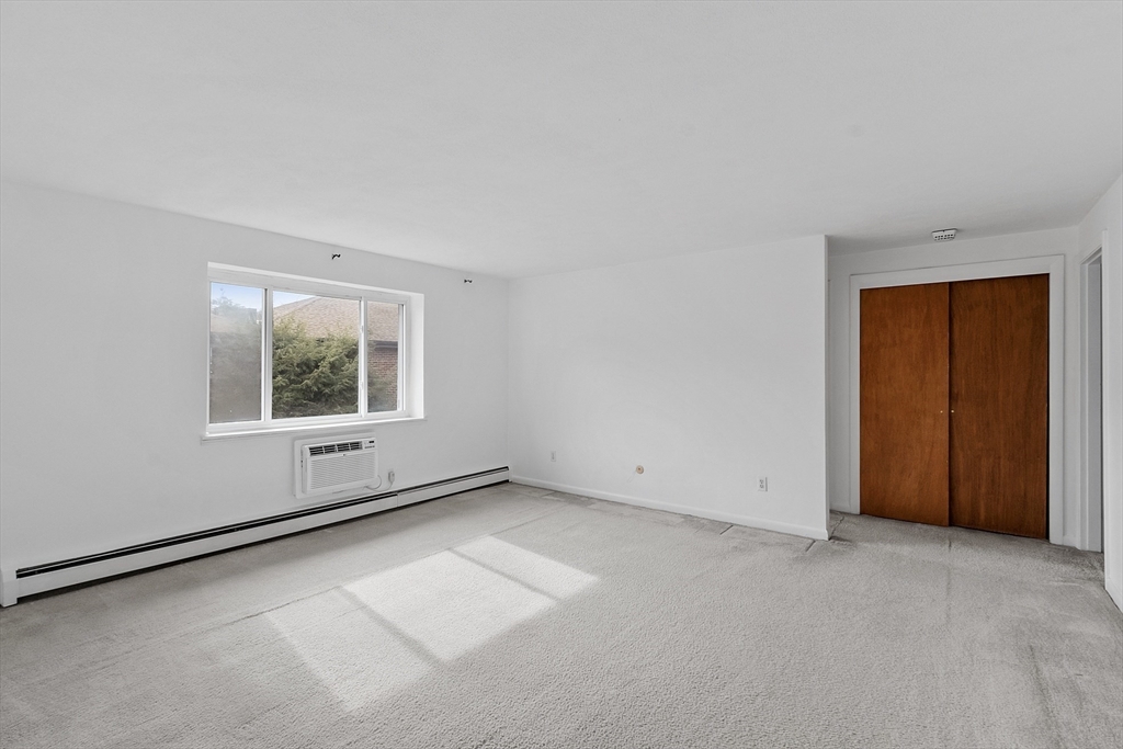 26 Bryon Road, Unit 3 Boston, MA 02467 - Photo 12 of 30 an empty room with a window