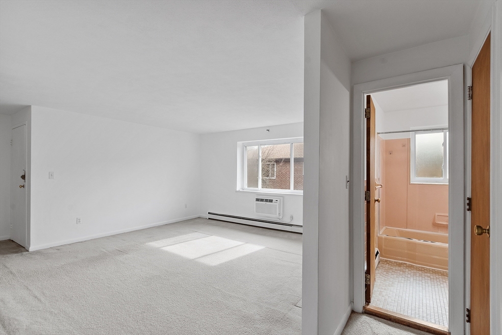 26 Bryon Road, Unit 3 Boston, MA 02467 - Photo 13 of 30 an empty room with windows