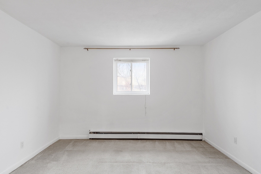 26 Bryon Road, Unit 3 Boston, MA 02467 - Photo 15 of 30 an empty room with a window