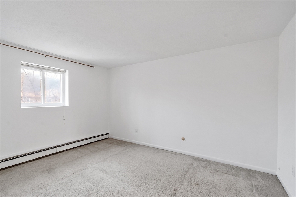 26 Bryon Road, Unit 3 Boston, MA 02467 - Photo 16 of 30 an empty room with a window