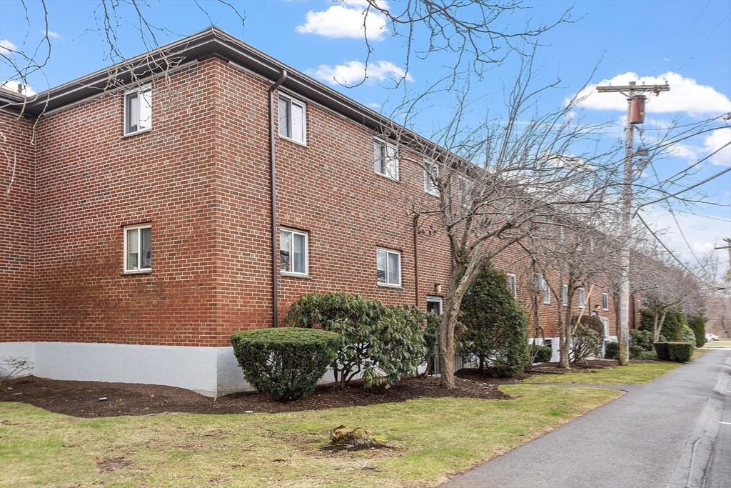 26 Bryon Road, Unit 3 Boston, MA 02467 - Photo 24 of 30 a view of a house with a yard