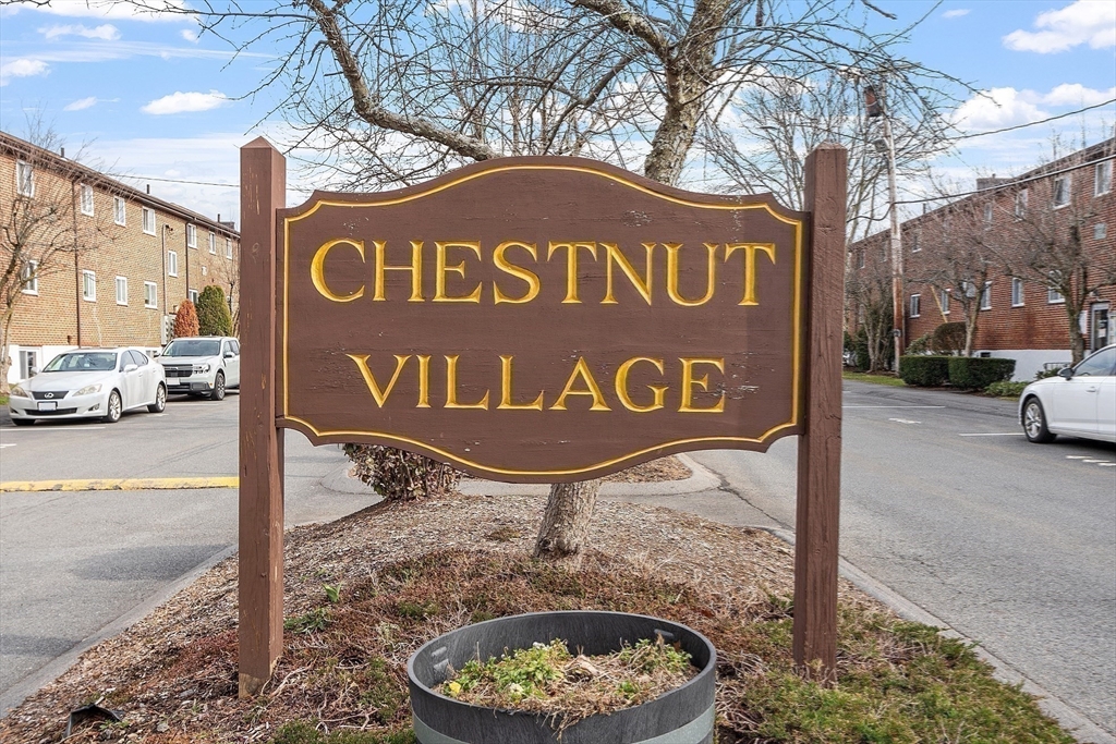 26 Bryon Road, Unit 3 Boston, MA 02467 - Photo 27 of 30 a sign board with a outdoor seating